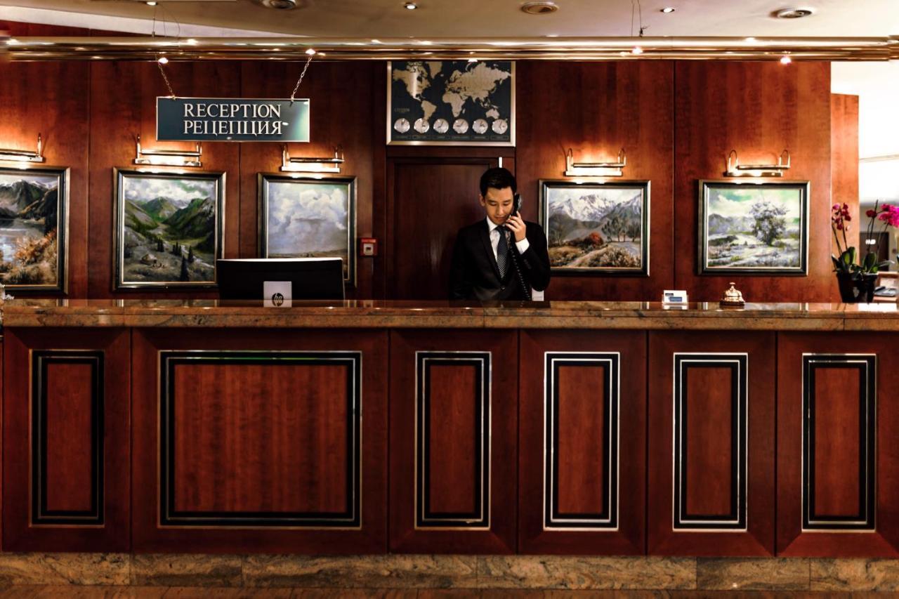 Rahat Palace Hotel Алма Ата Екстериор снимка Reception desk at a hotel